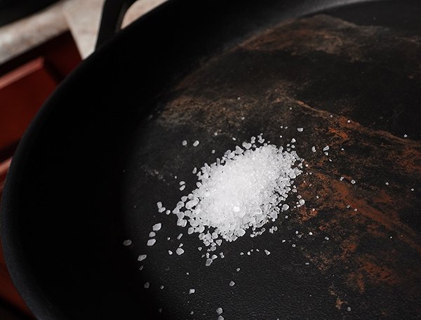 Using salt to clean a cast iron skillet